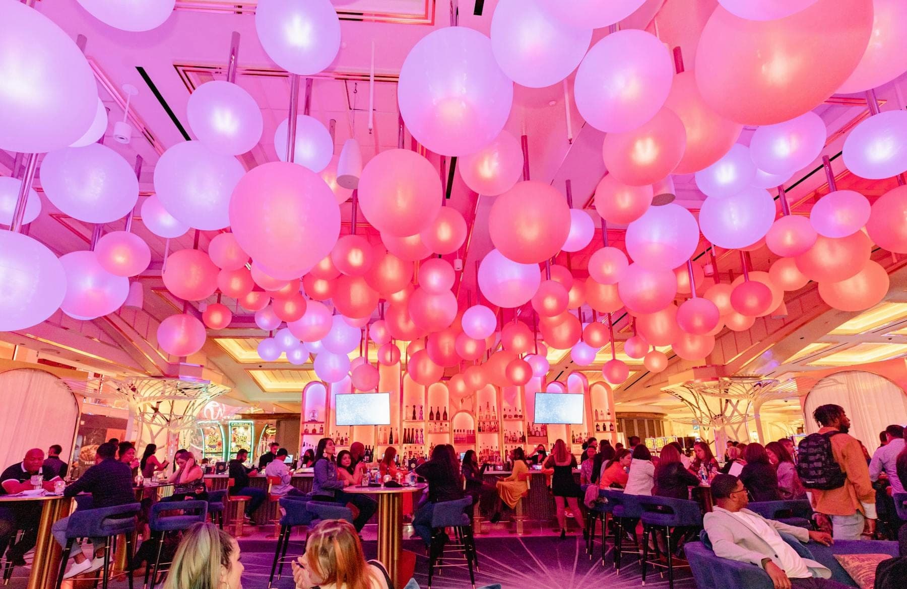Packed Gatsby’s lounge under the sphere ceiling lights
